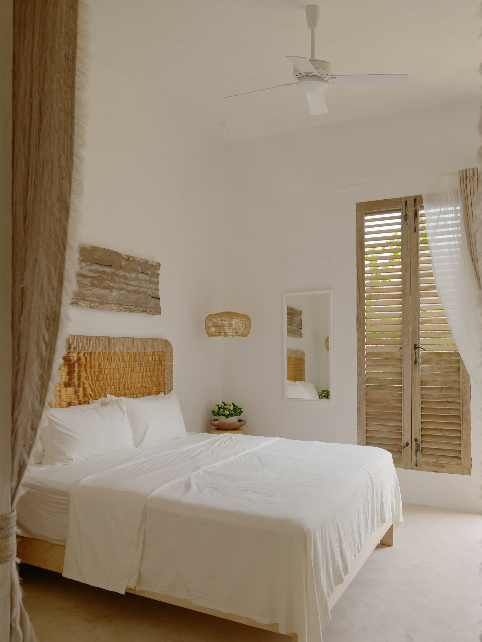 A made bed with layered linens